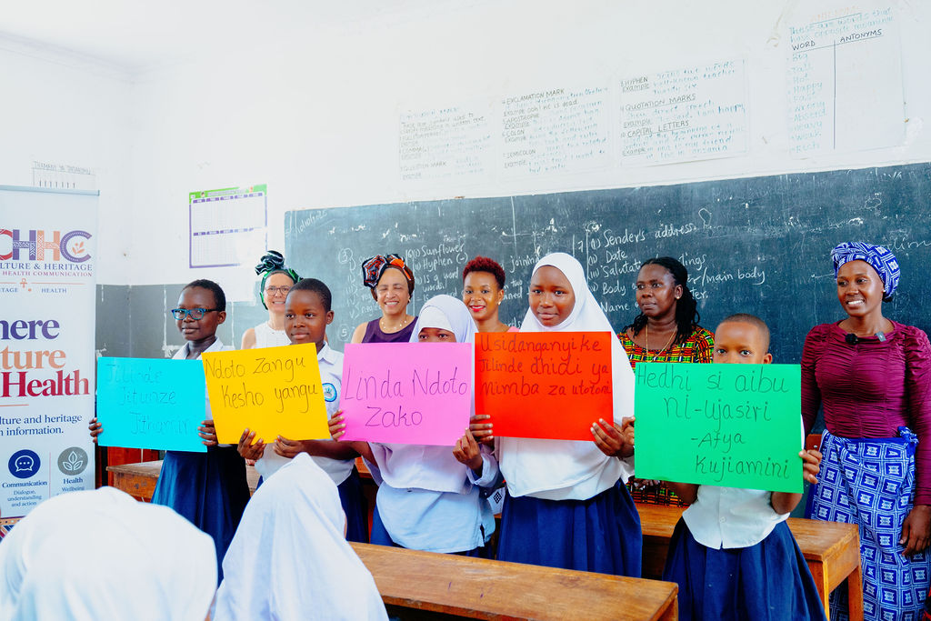Students and facilitators taking part in a community health communication workshop